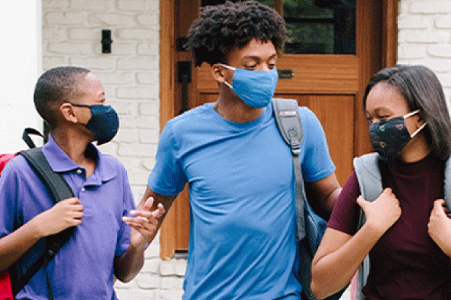 Group of 3 young teens smiling and talking together